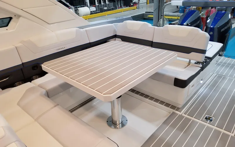 Slide: The Image of 2026 Formula 400 Super Sport Crossover boat interior with sleek seating and table. - 14