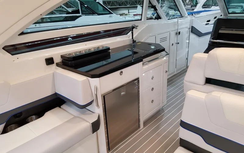 Slide: The Image of Interior of 2026 Formula 400 Super Sport Crossover yacht with sleek kitchenette and seating. - 15