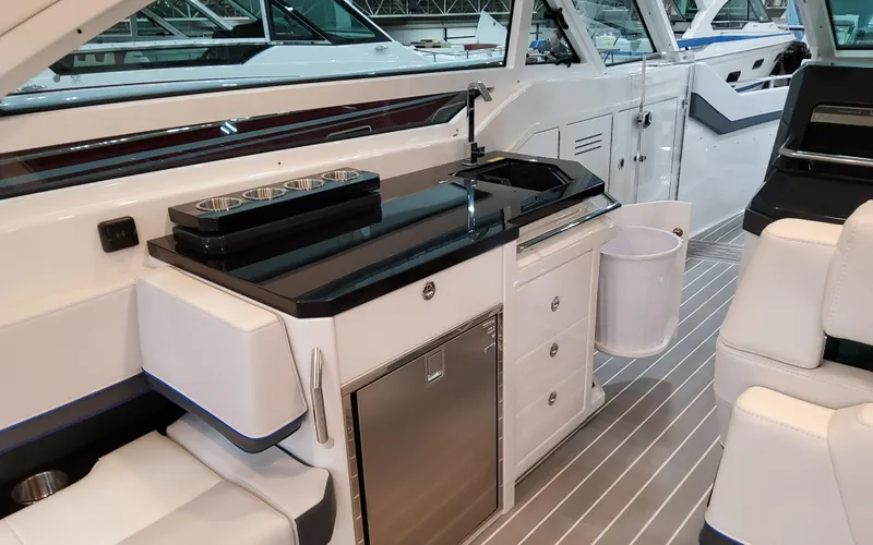 Slide: The Image of Interior of 2026 Formula 400 Super Sport Crossover with sleek kitchenette and modern design. - 16