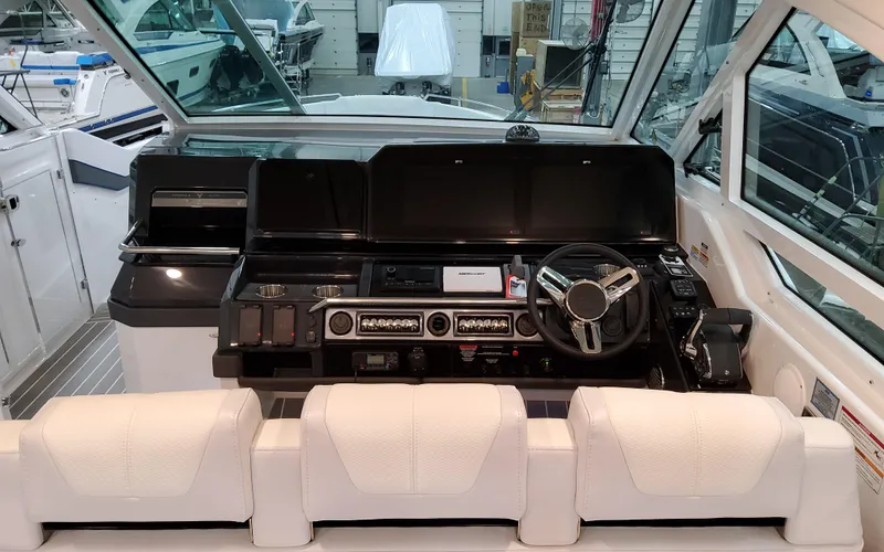 Slide: The Image of 2026 Formula 400 Super Sport Crossover helm with modern controls and luxurious seating. - 19