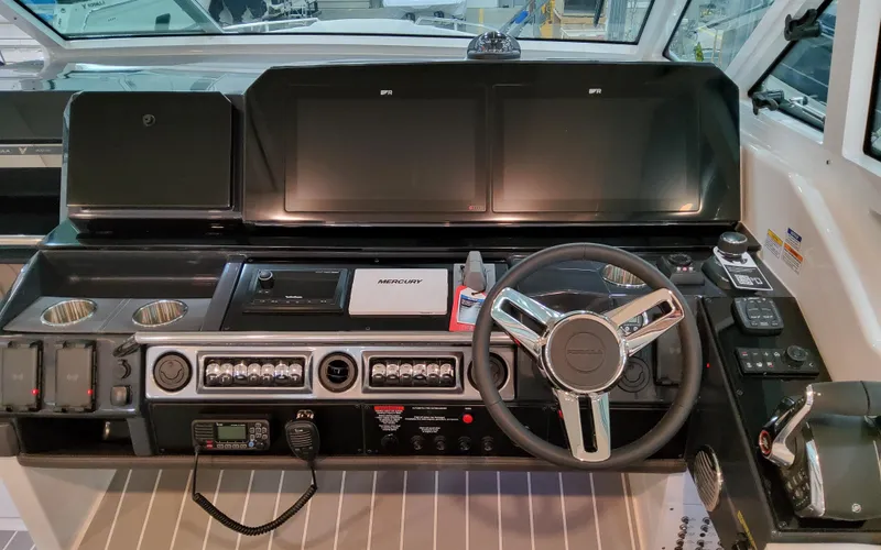 Slide: The Image of 2026 Formula 400 Super Sport Crossover dashboard with advanced controls and steering wheel. - 20