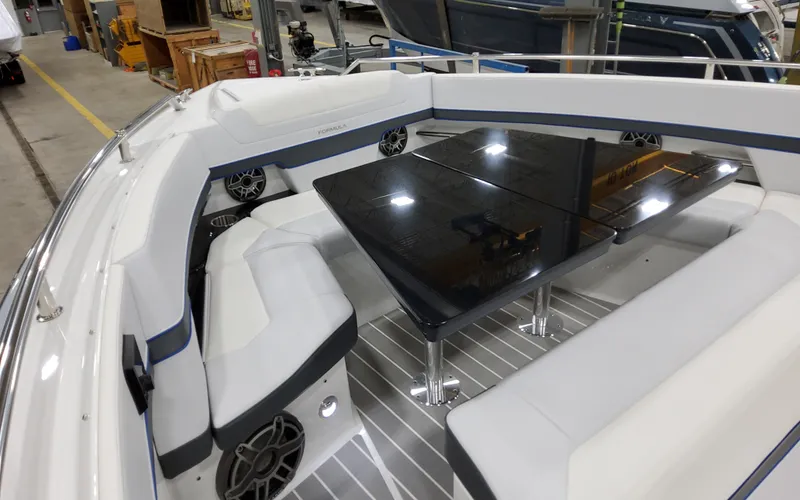 Slide: The Image of 2026 Formula 400 Super Sport Crossover boat interior with sleek seating and glossy table. - 23