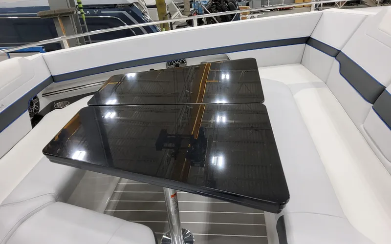 Slide: The Image of 2026 Formula 400 Super Sport Crossover interior with sleek black table and white seating. - 24