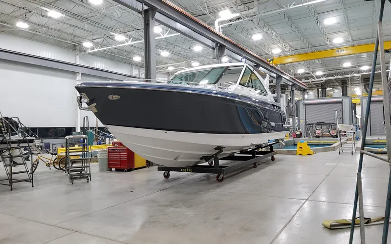 Slide: The Image of 2026 Formula 400 Super Sport Crossover boat in a modern indoor facility. - 3