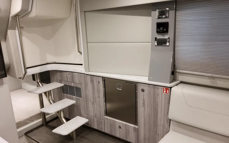 Slide: The Image of Interior of 2026 Formula 400 Super Sport Crossover, featuring modern cabinetry and sleek design. - 31