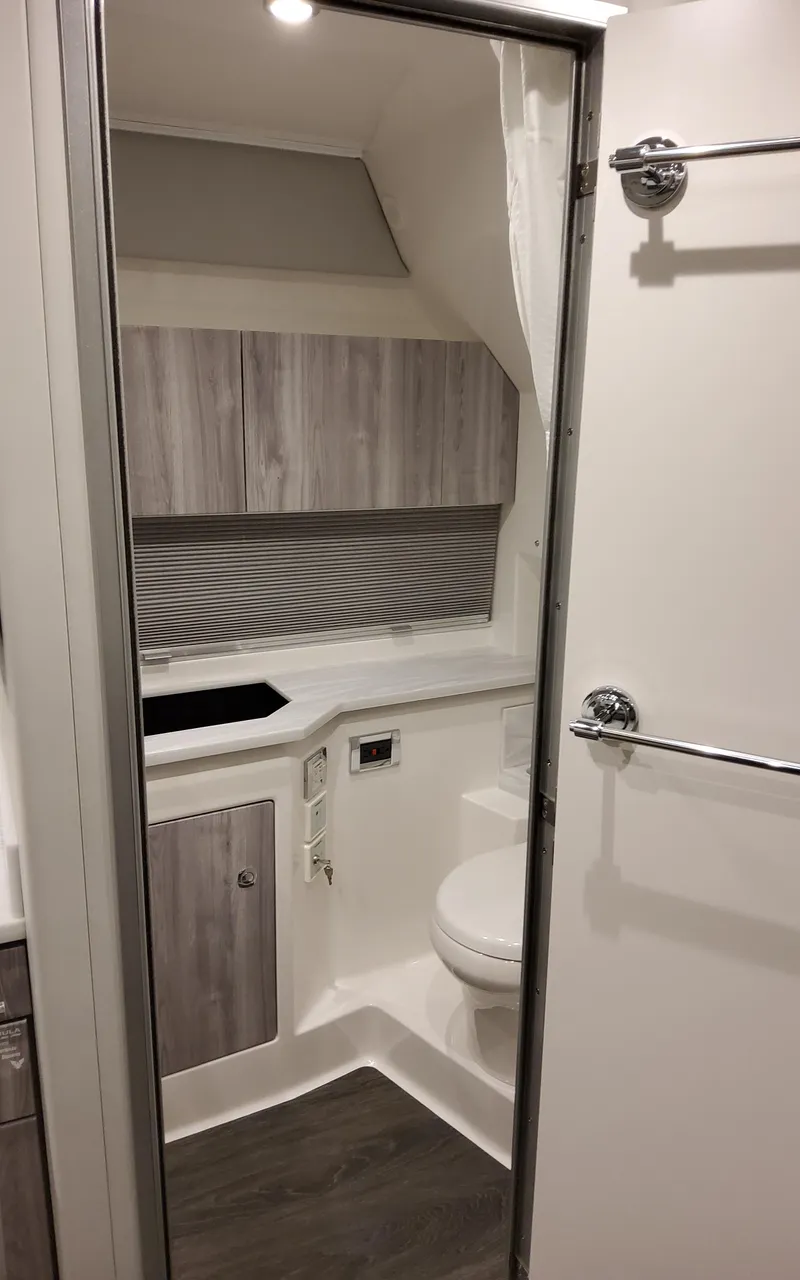 Slide: The Image of 2026 Formula 400 Super Sport Crossover bathroom with modern design and wood accents. - 33