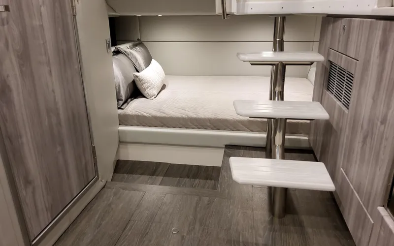 Slide: The Image of Interior of 2026 Formula 400 Super Sport Crossover, featuring a cozy bed and modern design. - 34