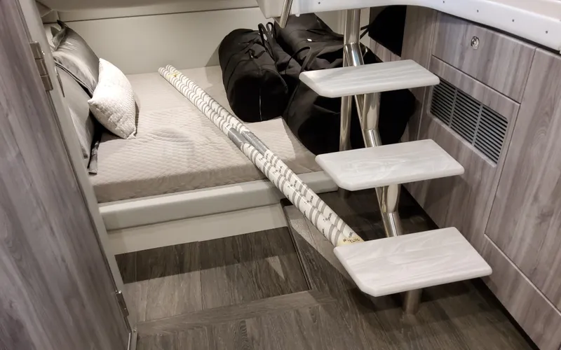 Slide: The Image of Interior of 2026 Formula 400 Super Sport Crossover with bed, steps, and bags. - 45