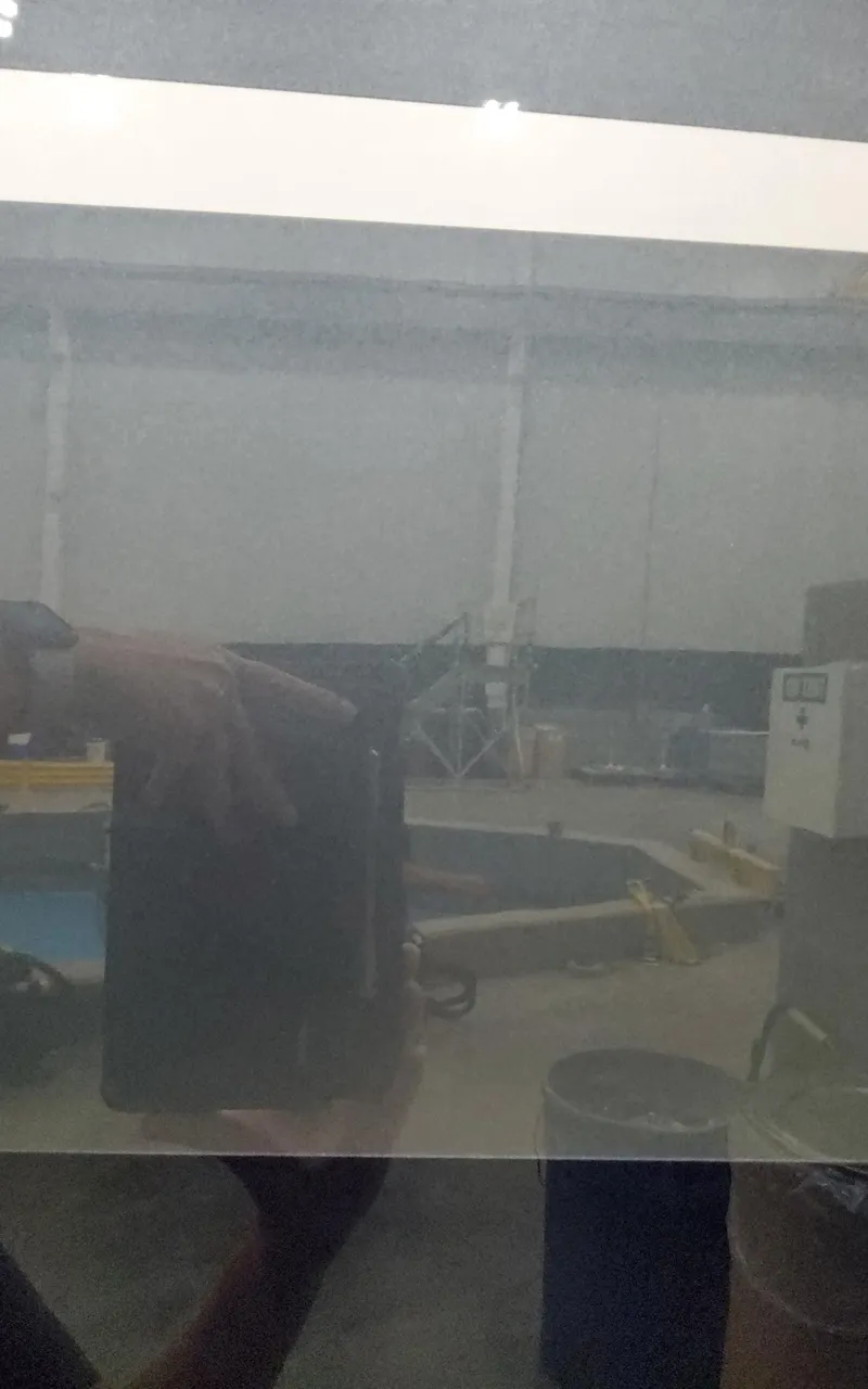 Slide: The Image of Reflection in a window showing an indoor industrial setting with equipment. - 6