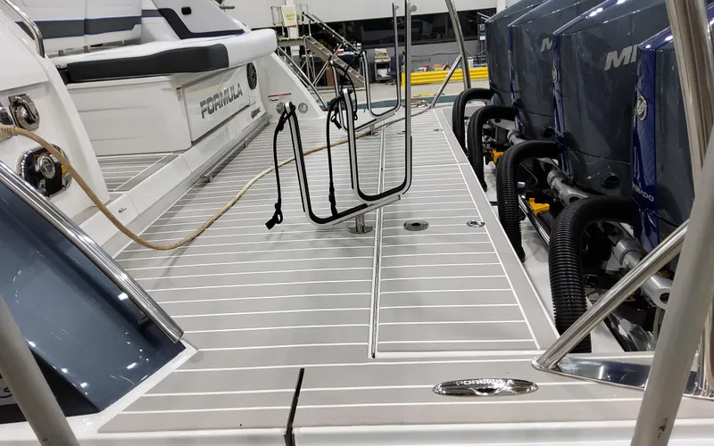 Slide: The Image of 2026 Formula 400 Super Sport Crossover boat deck with outboard engines and seating area. - 7