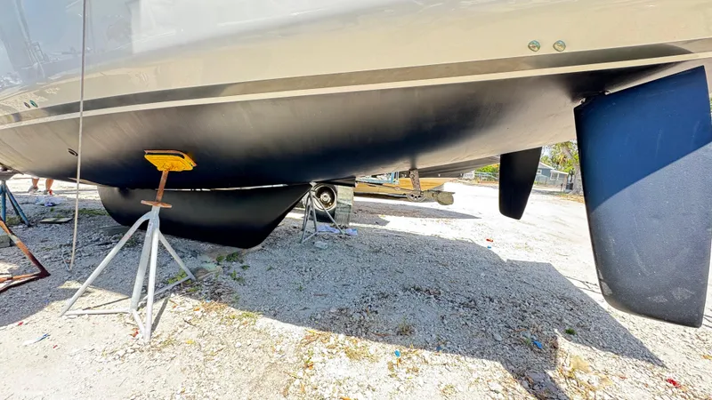 Slide: The Image of 2023 Beneteau Oceanis 34.1 sailboat hull and keel on dry dock. - 14