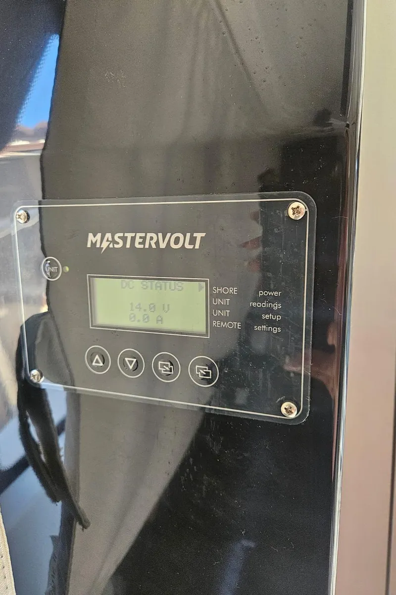 Slide: The Image of Mastervolt control panel on 2023 Jeanneau NC795 S2 boat, displaying voltage settings. - 24