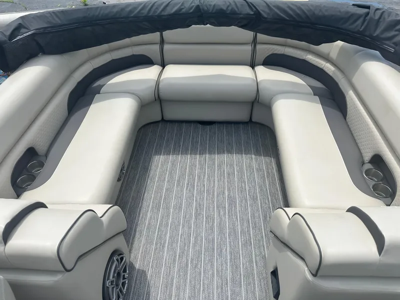 Slide: The Image of Luxurious seating area of 2023 Premier 250 Solaris pontoon boat with cup holders and speakers. - 11