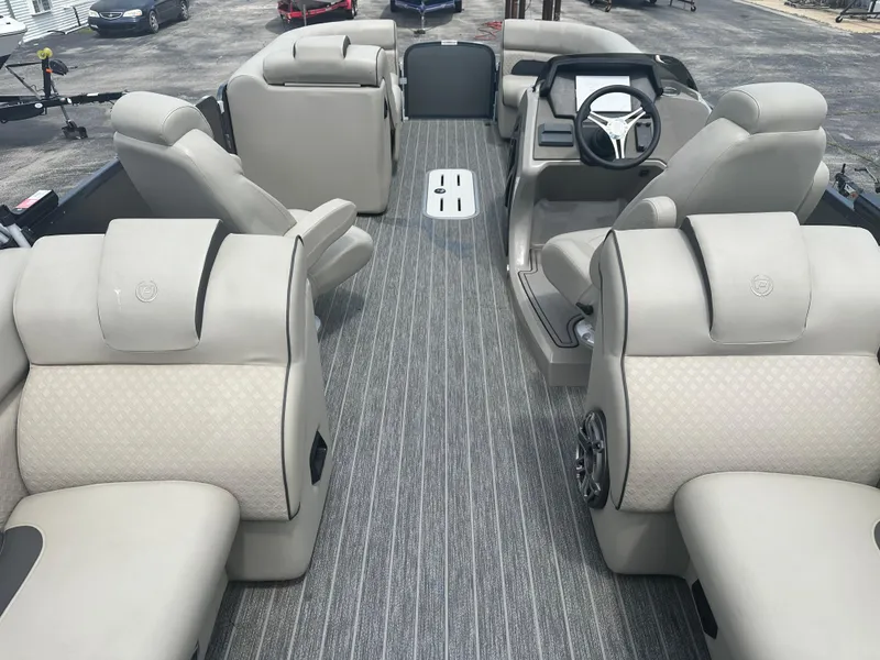 Slide: The Image of 2023 Premier 250 Solaris boat interior with luxurious seating and modern steering console. - 12