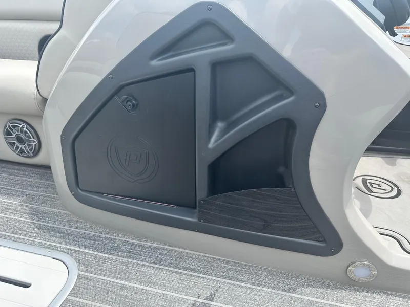 Slide: The Image of Interior detail of 2023 Premier 250 Solaris boat, featuring sleek design and speaker system. - 13