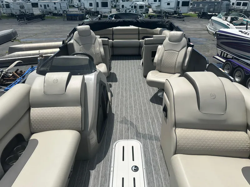 Slide: The Image of Luxurious 2023 Premier 250 Solaris pontoon boat with plush seating and modern design. - 7