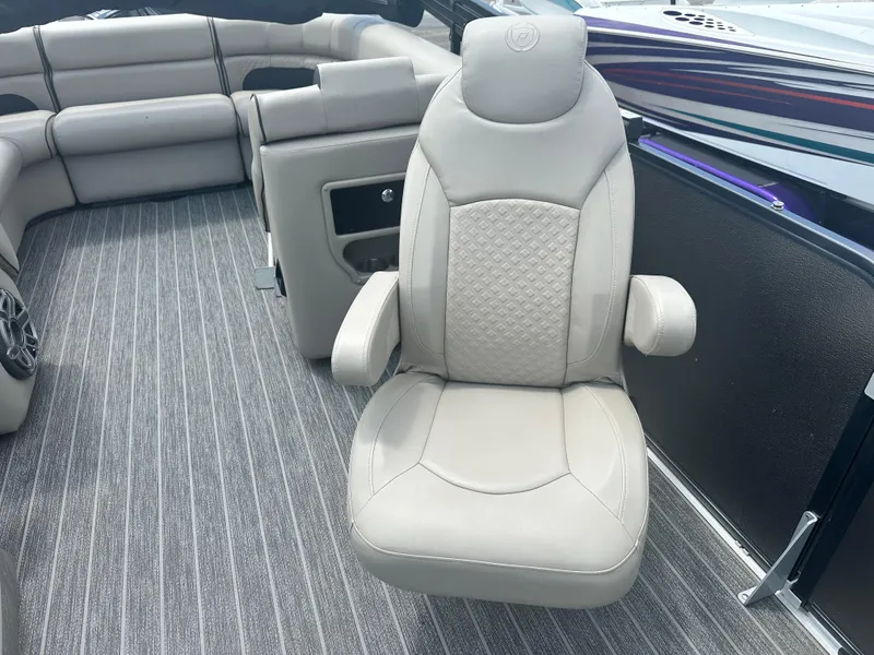 Slide: The Image of Luxury seating on 2023 Premier 250 Solaris boat with elegant upholstery and spacious layout. - 9