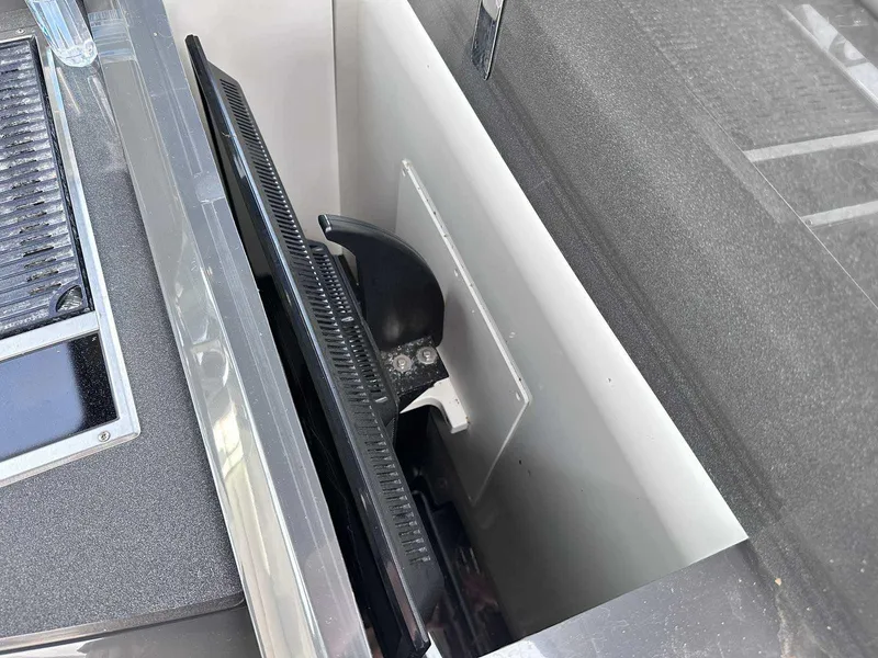 Slide: The Image of Hidden TV compartment on 2019 Cobalt A36 boat, showcasing sleek design and functionality. - 15