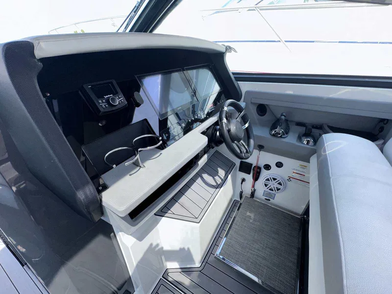 Slide: The Image of Interior of 2019 Cobalt A36 boat cockpit with steering wheel and control panel. - 20