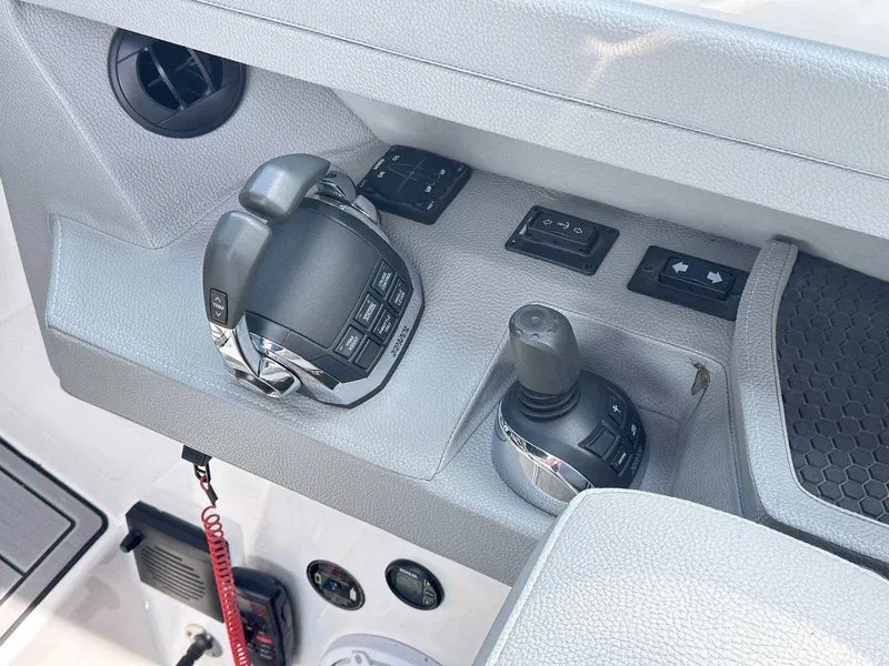 Slide: The Image of Control panel of a 2019 Cobalt A36 boat with joystick and throttle. - 22