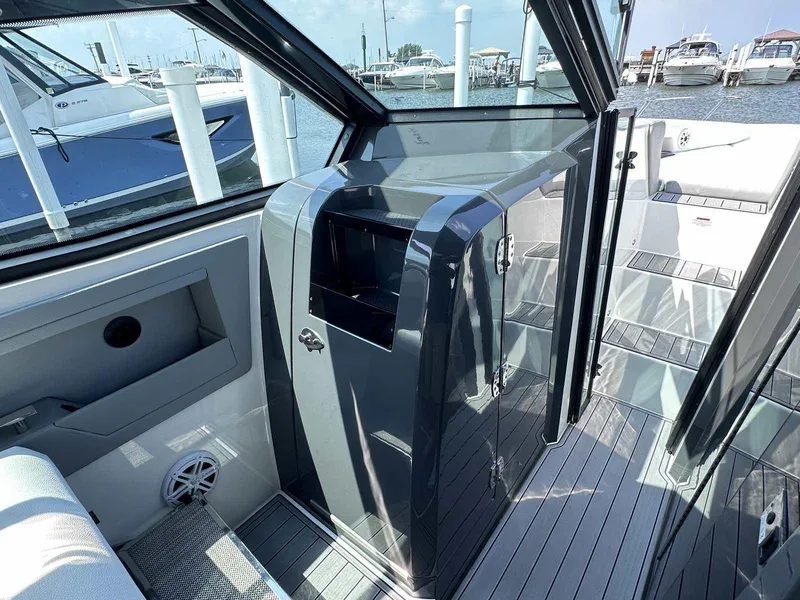 Slide: The Image of 2019 Cobalt A36 boat interior with sleek design and modern finishes at a marina. - 26