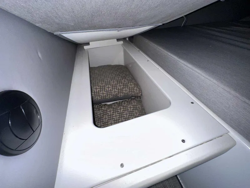 Slide: The Image of 2019 Cobalt A36 interior storage compartment with patterned cushion. - 32