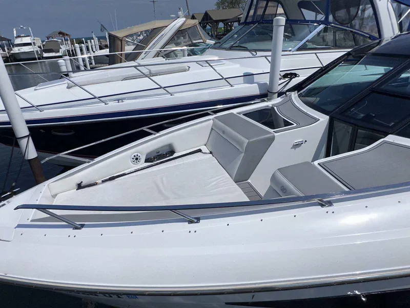 Slide: The Image of 2019 Cobalt A36 boat docked, featuring sleek design and spacious seating area. - 4