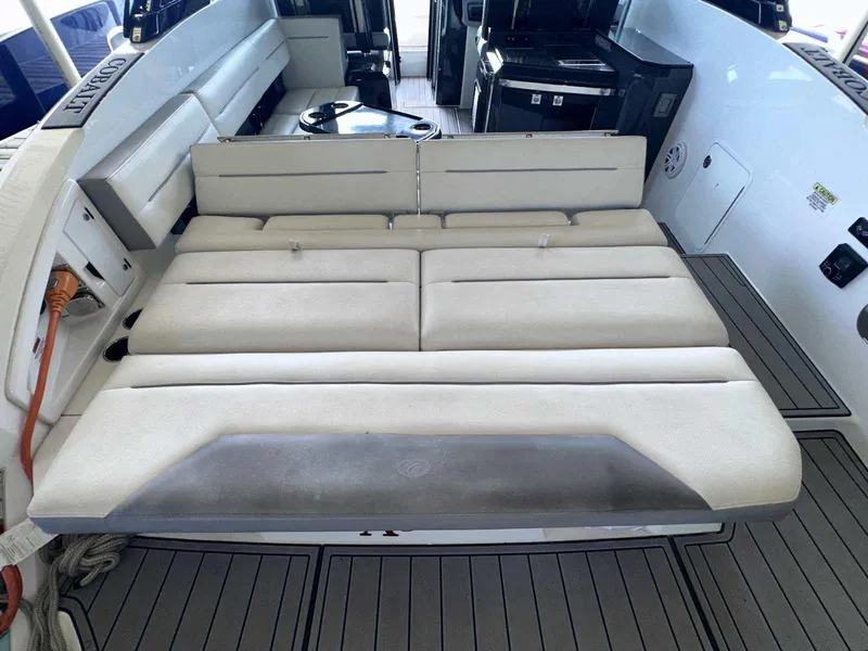 Slide: The Image of 2019 Cobalt A36 boat interior with cushioned seating and modern design. - 6