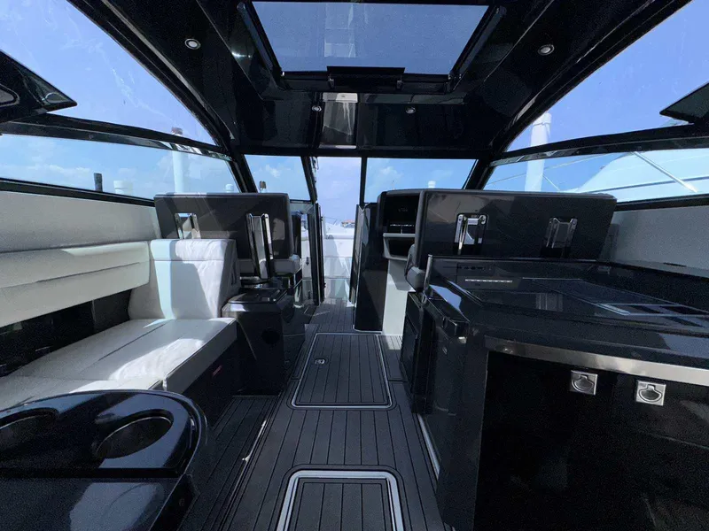 Slide: The Image of Interior of a 2019 Cobalt A36 yacht with sleek black and white design. - 9