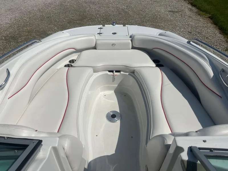 Slide: The Image of 2007 Crownline 220 EX boat interior with white seating and red accents. - 3