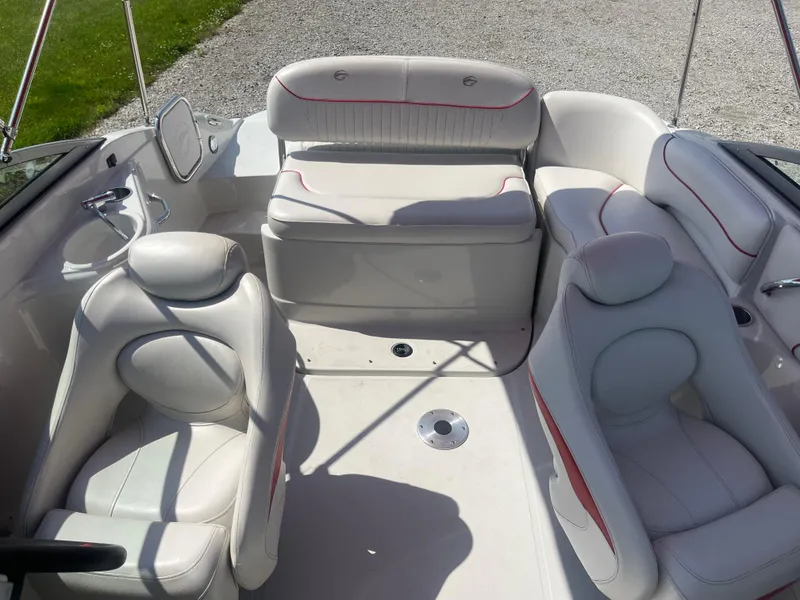 Slide: The Image of 2007 Crownline 220 EX boat interior with white seating and red accents. - 5