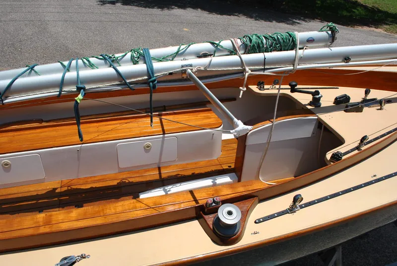 Slide: The Image of 2006 Edey & Duff Sakonnet 23 sailboat interior with wooden details and rigging. - 17