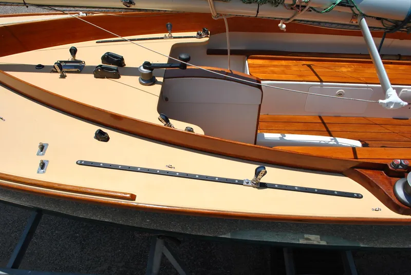 Slide: The Image of 2006 Edey & Duff Sakonnet 23 sailboat deck with wooden trim and rigging details. - 21