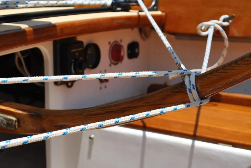 Slide: The Image of Close-up of 2006 Edey & Duff Sakonnet 23 sailboat rigging and wooden details. - 23