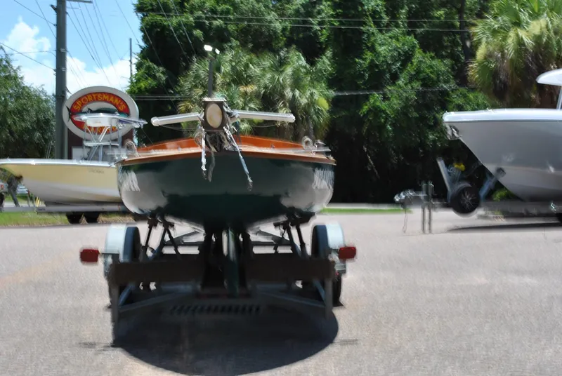 Slide: The Image of 2006 Edey & Duff Sakonnet 23 boat on trailer, parked outdoors near other boats. - 3