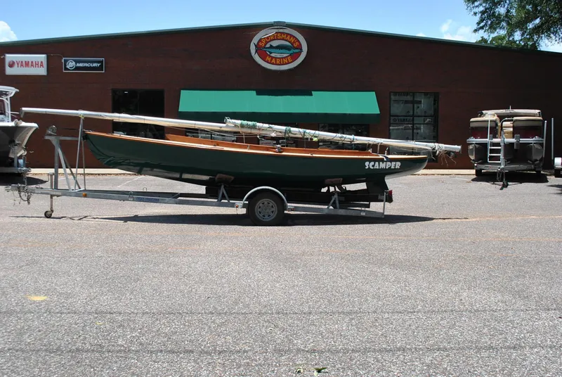 Slide: The Image of 2006 Edey & Duff Sakonnet 23 sailboat on trailer outside Sportsman's Marine. - 6