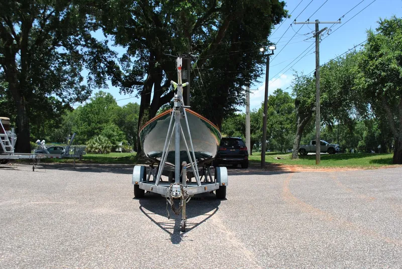 Slide: The Image of 2006 Edey & Duff Sakonnet 23 sailboat on trailer in a sunny park setting. - 8