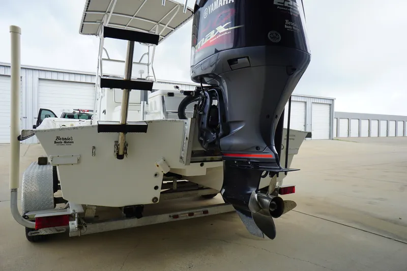 Slide: The Image of 2015 Desperado 22 Outlaw boat with Yamaha engine on trailer. - 4