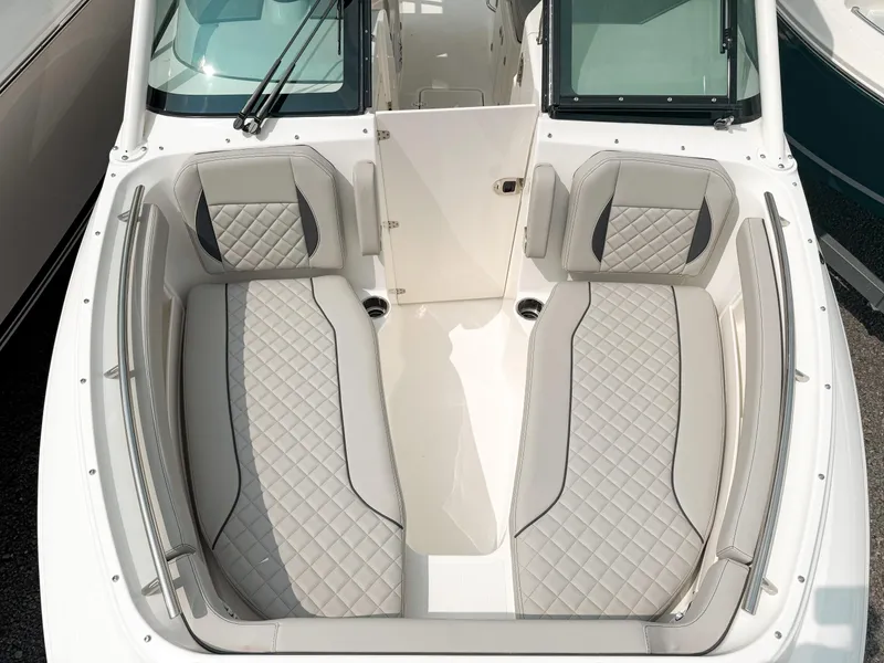 Slide: The Image of 2025 Pursuit DC 266 Dual Console boat with luxurious seating and modern design. - 18