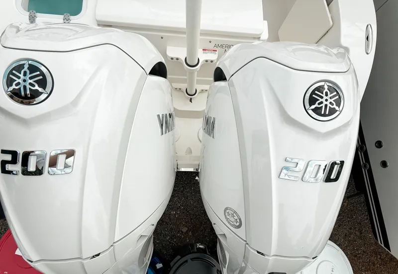 Slide: The Image of Twin Yamaha 200 engines on a 2025 Pursuit DC 266 Dual Console boat. - 5