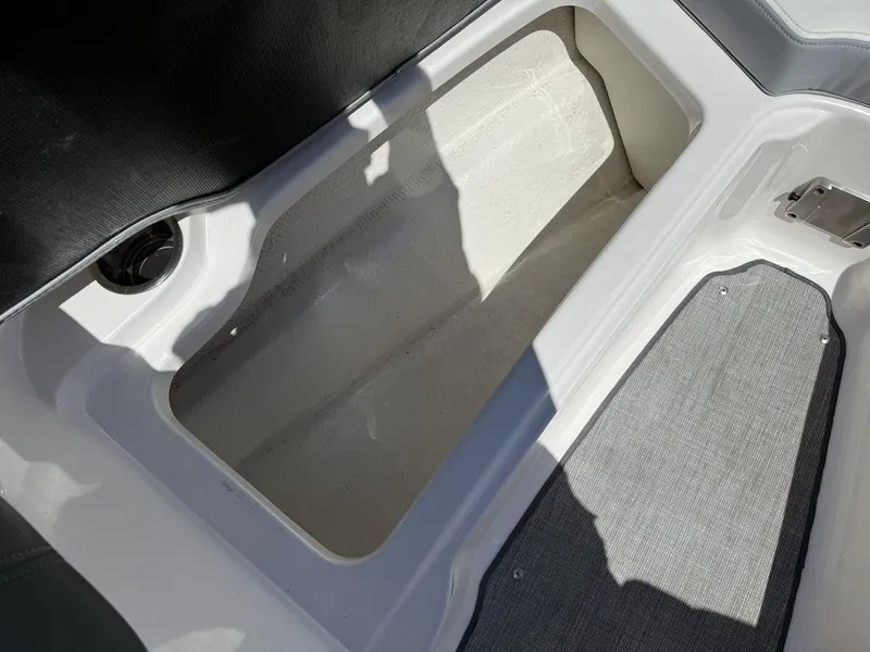 Slide: The Image of Storage compartment in 2022 Chaparral 23 SSi boat, featuring spacious interior and sleek design. - 12