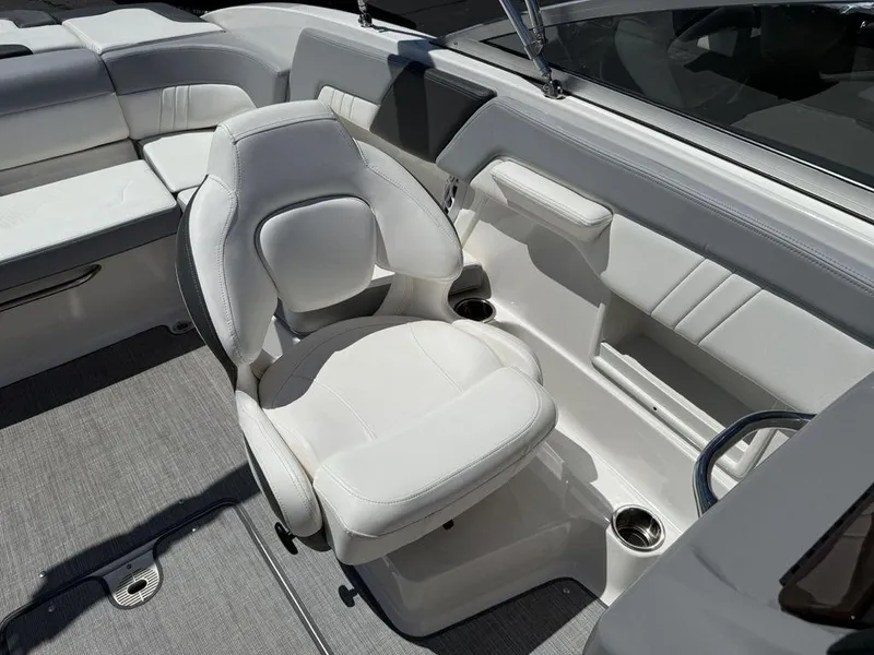 Slide: The Image of 2022 Chaparral 23 SSi boat interior with white seating and modern design. - 26