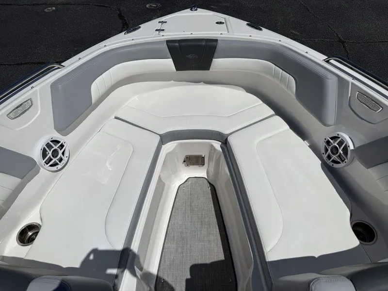 Slide: The Image of 2022 Chaparral 23 SSi boat interior with white seating and speakers. - 7