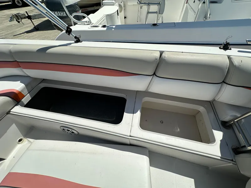 Slide: The Image of 2017 Starcraft MDX 191 OB boat interior with open storage compartments. - 10