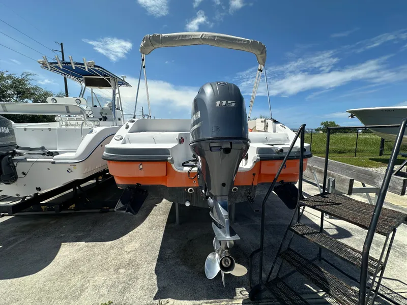 Slide: The Image of 2017 Starcraft MDX 191 OB boat with Yamaha 115 outboard motor, docked under clear skies. - 3