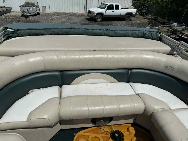 Slide: The Image of 1999 Smoker Craft 8526 Pleasure Isle I/O boat interior with cushioned seating. - 15