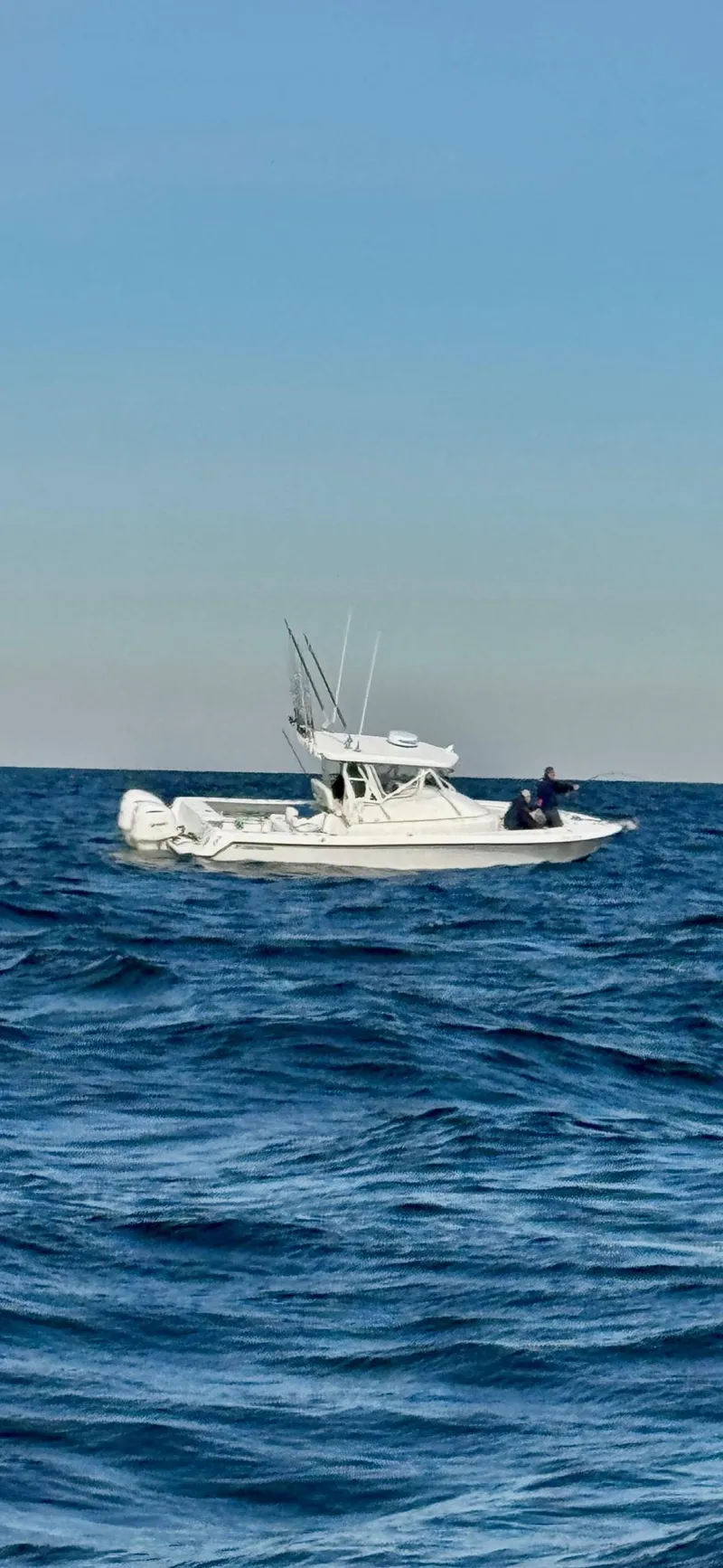 Slide: The Image of 2004 Contender 31 Fish Around boat on open sea under clear sky. - 2