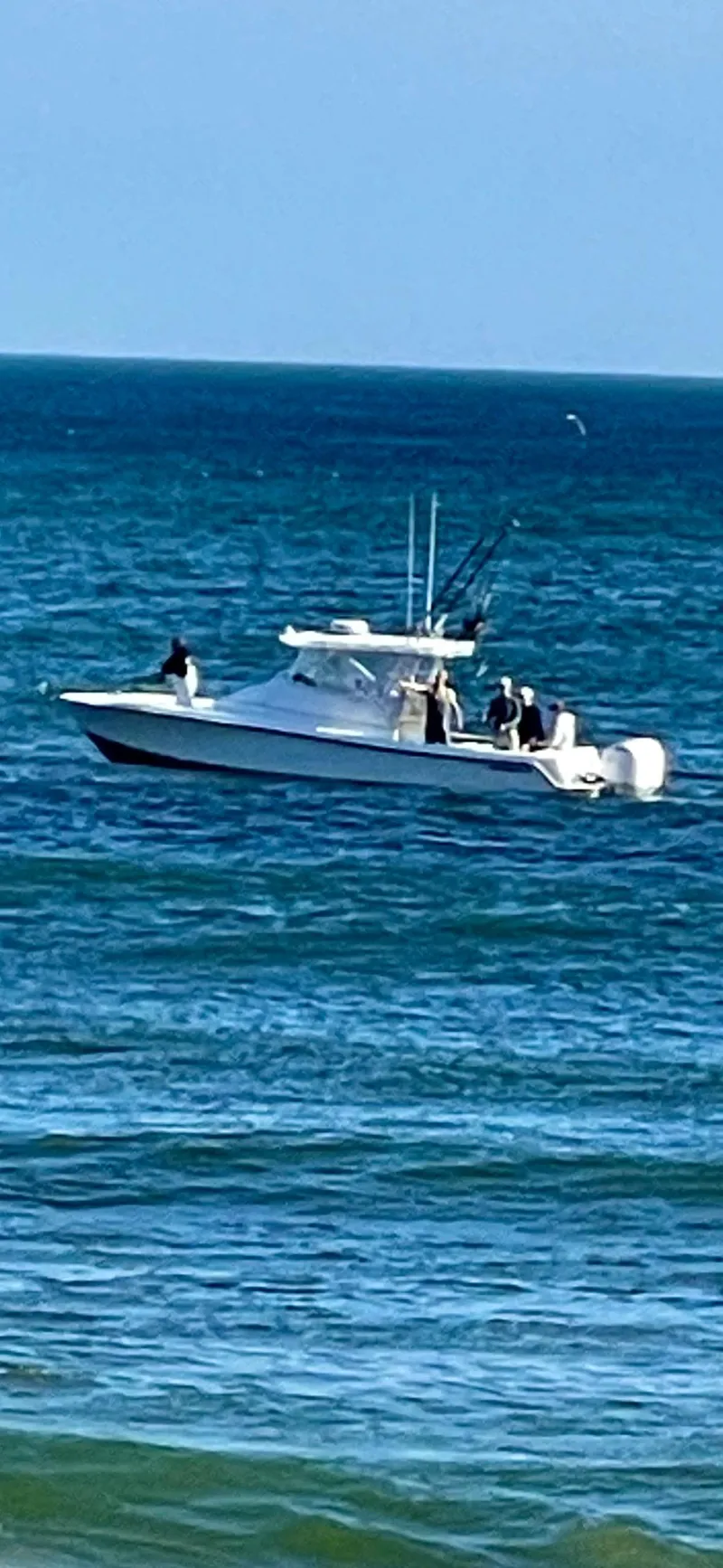 Slide: The Image of 2004 Contender 31 Fish Around boat on open sea, clear blue water. - 3