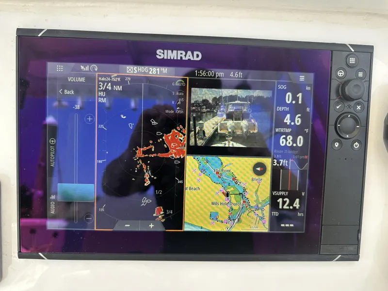 Slide: The Image of Simrad marine navigation display on 2004 Contender 31 Fish Around boat, showing radar and map data. - 8