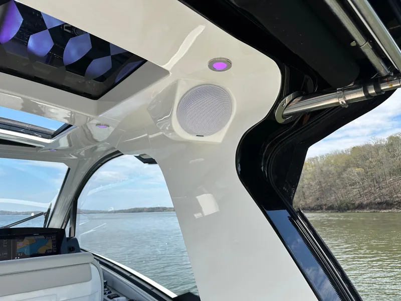 Slide: The Image of Interior view of 2024 Sea Ray Sundancer 370 boat with modern design and scenic water backdrop. - 17